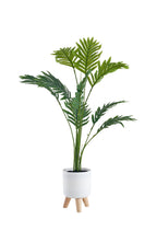 Pianta artificiale  con vaso treppiede