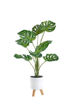 Pianta artificiale  con vaso treppiede