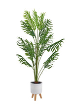 Pianta artificiale  con vaso treppiede